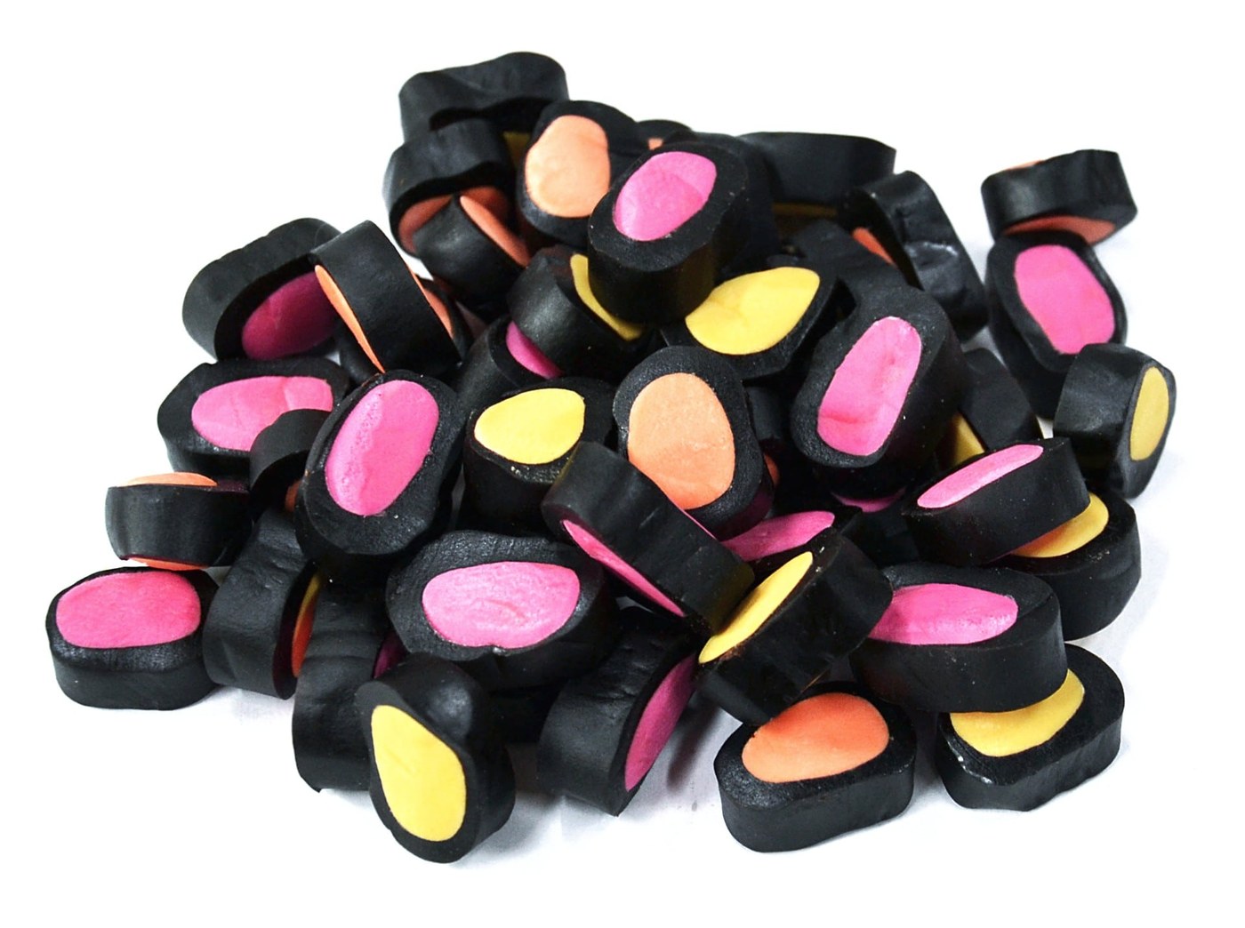Black licorice pieces filled with pink, yellow and orange fruit paste centers — made using Extrufood cooking and forming extruders